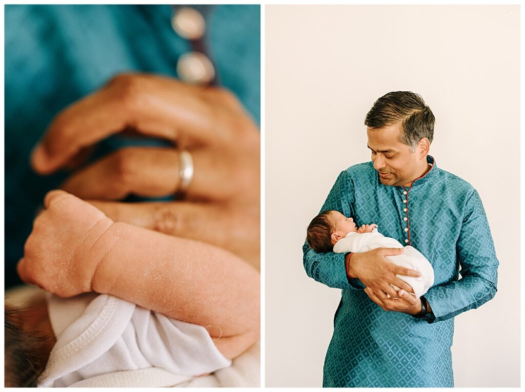 Dad holding newborn girl 