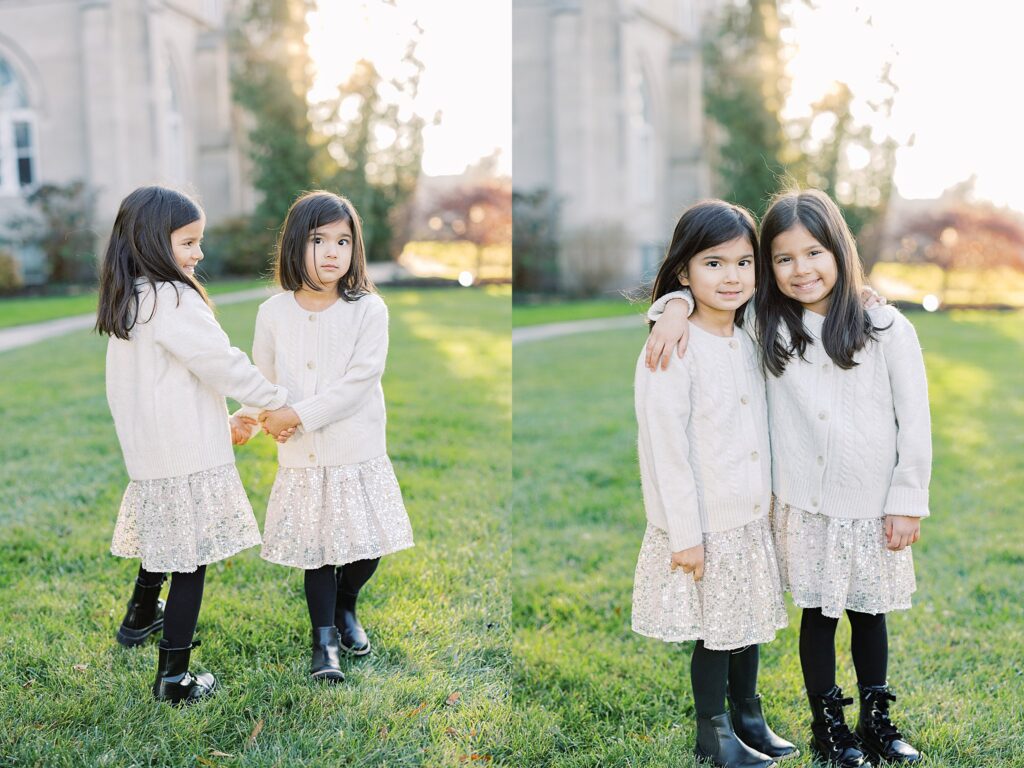 two sisters holding hands wearing white outfits with black boots 
